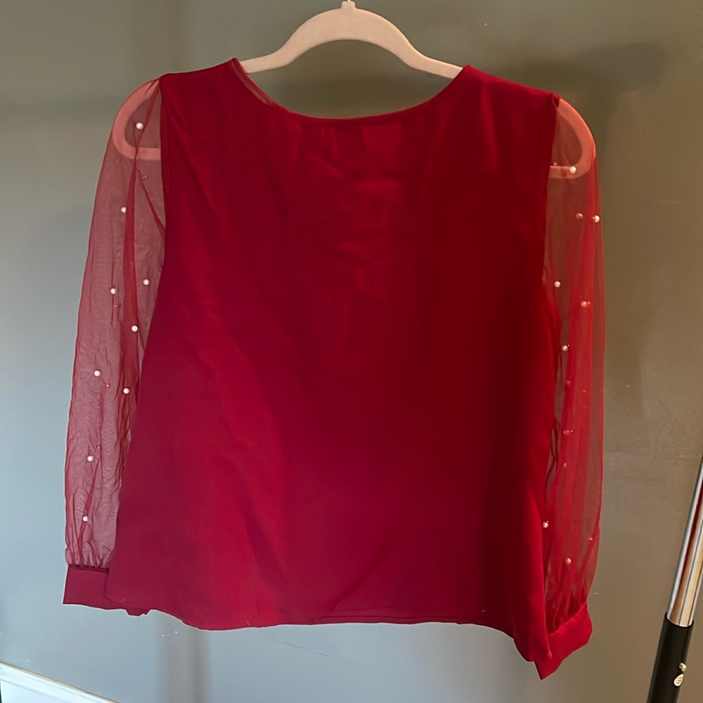Maroon long sleeve blouse with pearl detail. Medium.